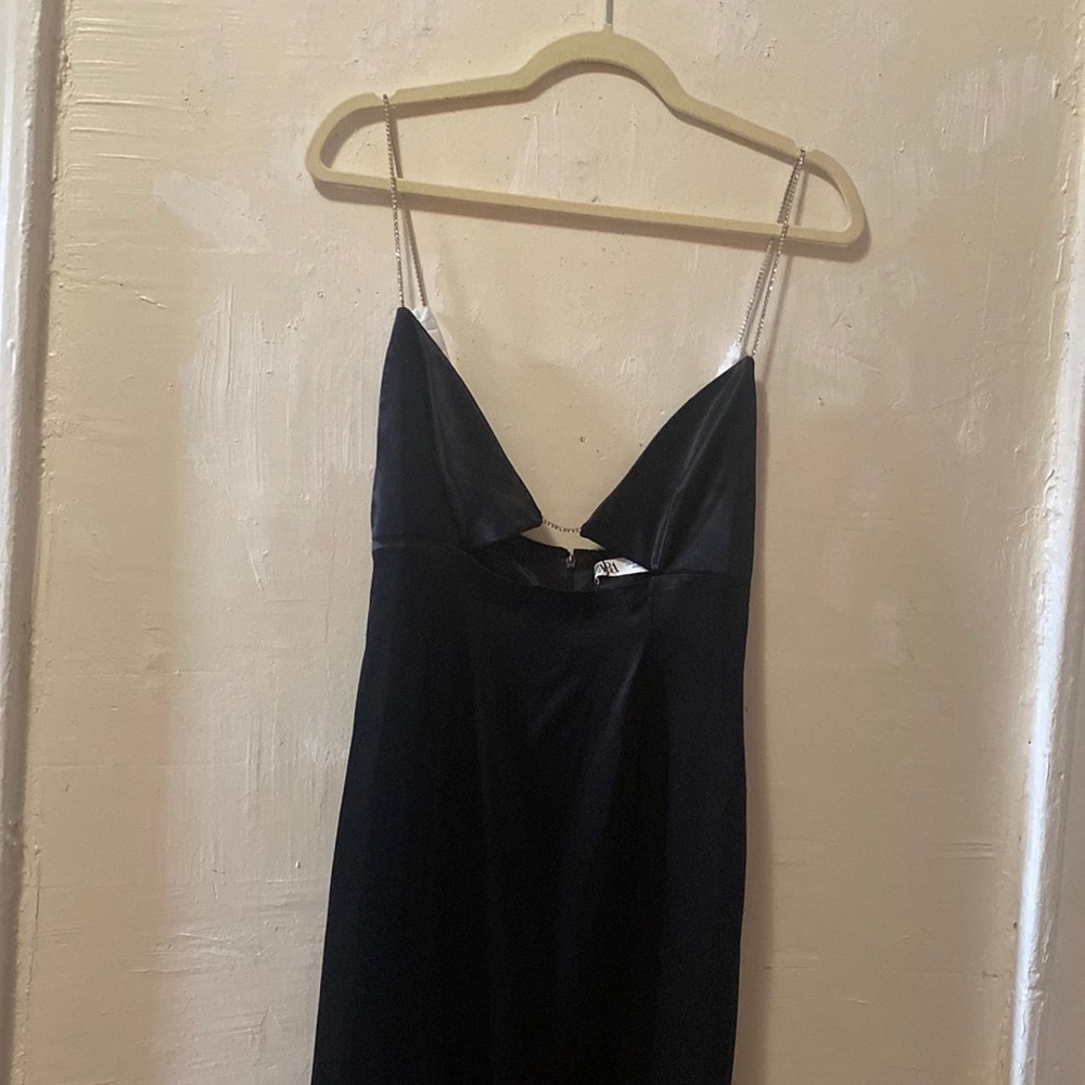 black long dress with rhinestone strap and slit in the back.